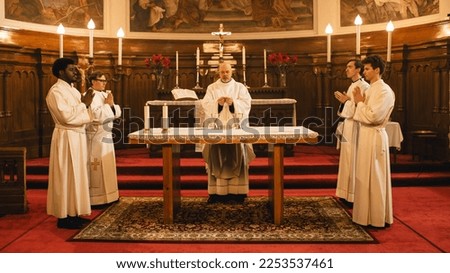 Ministers Leading The Eucharist, Sacred Christian Ceremony Of the Sharing Of Bread And Wine To Remember Jesus' Sacrifice, Offering Guidance and Support. Holy Communion, Divine Mass, The Lord's Supper Royalty-Free Stock Photo #2253537461