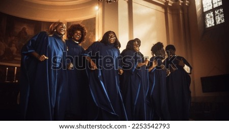 Black Christian Gospel Singers in Church Clapping and Stomping, Praising Lord Jesus Christ. Song Spreads Harmony Joy and Faith. Energetic Choir Sharing the Message of Christianity with Uplifting Music Royalty-Free Stock Photo #2253542793