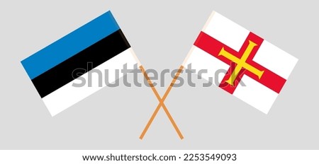 Crossed flags of Estonia and Bailiwick of Guernsey. Official colors. Correct proportion