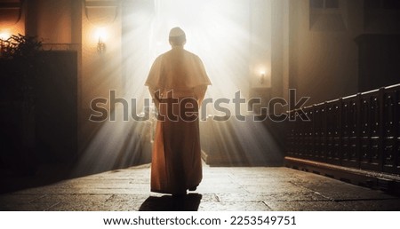 The Pope Walks Gracefully Through the Church, a Symbol Of Faith, Reverence, And Hope. Reminder of The Lord's Power, Beacon Of God's Love, Grace, And Mercy in Christian Faith. Blessing Light Shines Royalty-Free Stock Photo #2253549751