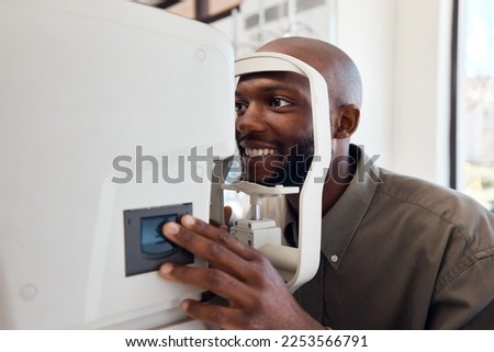 Seeing better starts right now. Shot of a young man getting his eyes examined with an autorefractor. Royalty-Free Stock Photo #2253566791