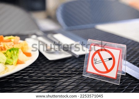 No smoking sign on the dining table in the restaurant