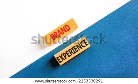 Brand experience symbol. Concept words Brand experience on wooden blocks. Beautiful white and blue background. Business branding and brand experience concept. Copy space.