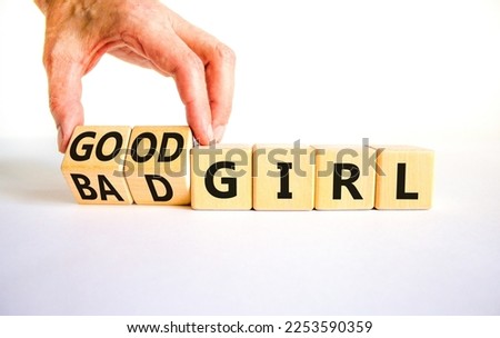 Good or bad girl symbol. Concept word Good girl Bad girl on wooden cubes. Businessman hand. Beautiful white table white background. Business psychological good or bad girl concept. Copy space.