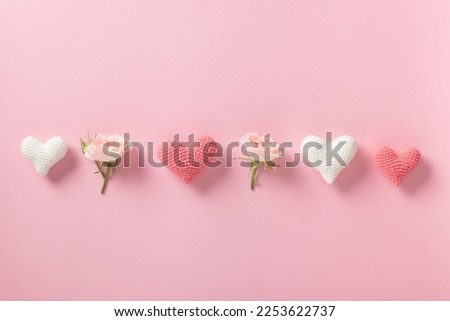 Valentine's Day background. Banner layout with roses and hearts on a light pink background with a space for text. Minimalism is love, romance. Space for copying. Flat position, top view.