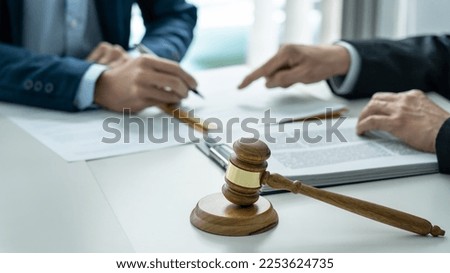 Male lawyer or notary working consulting and discussion to businesswoman client in the office, Law and Legal services concept.
