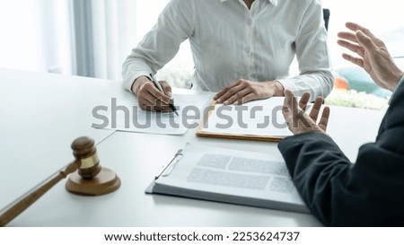 Businesswoman and Male lawyer or judge consult and conference having team meeting with client at law firm in office, Law and Legal services concept. Royalty-Free Stock Photo #2253624737