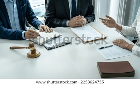 Businesspeople and Male lawyer consult and conference having team meeting with the client at a law firm in office, Law and Legal services concept.