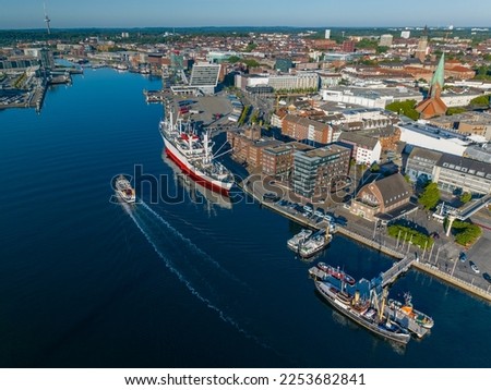 Aerial view of port of Kiel, Schleswig-Holstein, Germany. Aerial view of world's largest museum freight ship moored in Kiel harbour.  Royalty-Free Stock Photo #2253682841