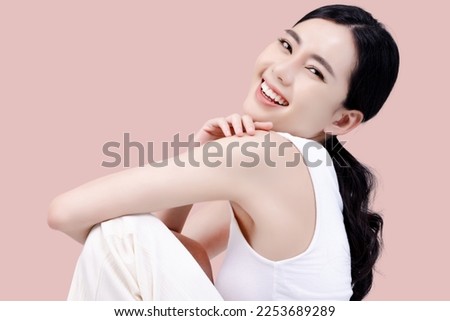 Studio shot of Beautiful young Asian woman with clean fresh skin on pink background, Face care, Facial treatment, Cosmetology, beauty and spa. Royalty-Free Stock Photo #2253689289