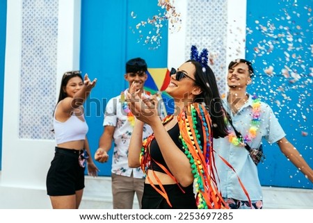 Brazilian Carnival. Group of friends celebrating carnival party Royalty-Free Stock Photo #2253697285