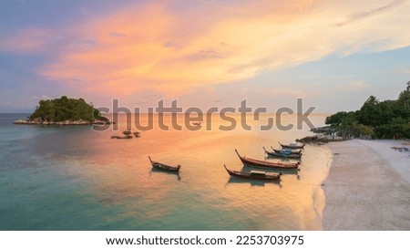Boats on sunrise Beachat Koh Lipe island, Satun Province, South, Thailand. Royalty-Free Stock Photo #2253703975