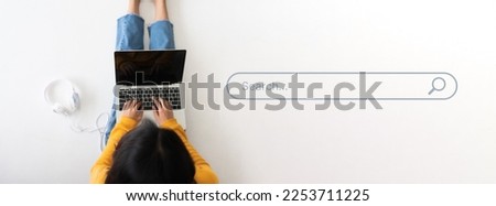 Top view of women use computer laptop to find what they are interested in. Searching information data on internet networking concept Royalty-Free Stock Photo #2253711225
