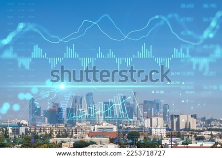Los Angeles panorama skyline of downtown at day time, California, USA. Skyscrapers of LA city. Glowing forex graph hologram. The concept of internet trading, brokerage and fundamental analysis