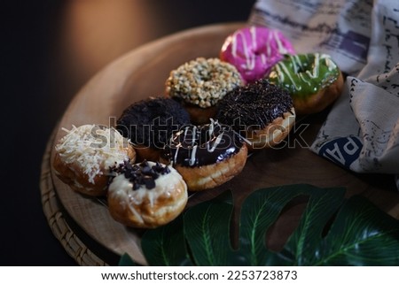 Colorfull Donut in a Wood Plate