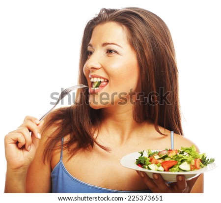 Young happy woman eating salad.Healthy lifestyle.