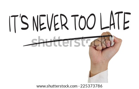 Motivational concept image of a hand holding marker and write Its never too late isolated on white