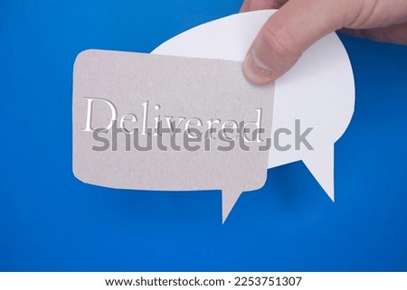 Speech bubble in front of colored background with Delivered text.