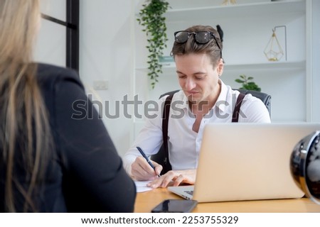 Young caucasian business woman sitting and job interview with manager at office, hr director talking and interview with recruitment personnel and contract agreement, two people, business concept.