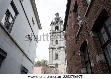 Architectural detail of the Belfry of Mons, the only belfry in Belgium constructed in Baroque style (inscribed on the UNESCO World Heritage on 1999), part of the major cultural patrimony of Wallonia Royalty-Free Stock Photo #2253756975