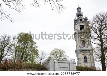 Architectural detail of the Belfry of Mons, the only belfry in Belgium constructed in Baroque style (inscribed on the UNESCO World Heritage on 1999), part of the major cultural patrimony of Wallonia Royalty-Free Stock Photo #2253756977