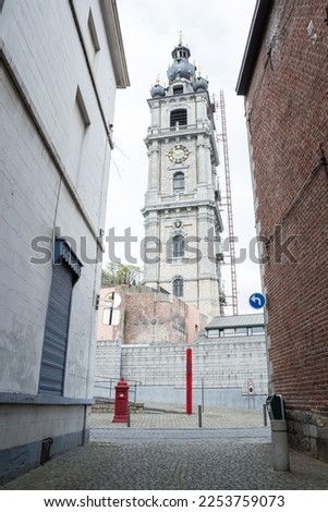 Architectural detail of the Belfry of Mons, the only belfry in Belgium constructed in Baroque style (inscribed on the UNESCO World Heritage on 1999), part of the major cultural patrimony of Wallonia Royalty-Free Stock Photo #2253759073