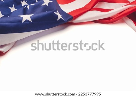 Part of the American flag is on a white background. Space for text. Close-up photo
