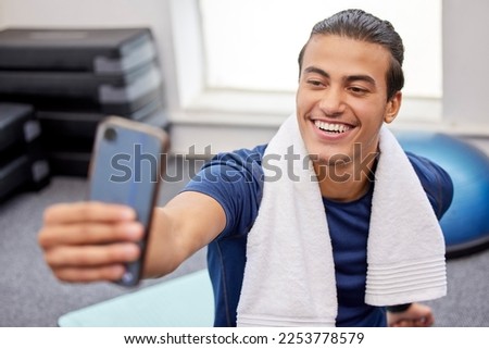 Fitness, man and smile for selfie, social media or profile picture with towel after workout exercise or training at the gym. Happy sporty male vlogger or influencer smiling in happiness for vlog post