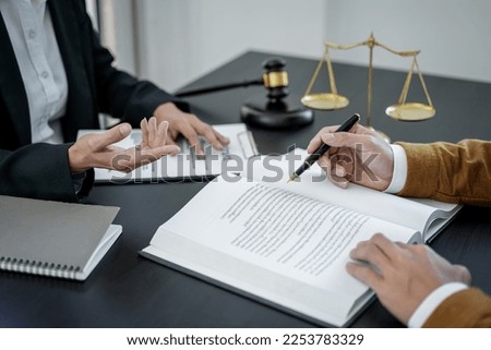 Male lawyer or notary working consulting and discussion to businesswoman client in the office, Law and Legal services concept. Royalty-Free Stock Photo #2253783329