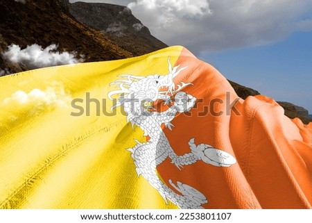 Bhutan national flag cloth fabric waving on beautiful mountain background.