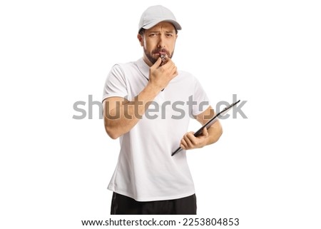Angry sports coach blowing a whistle isolated on white background Royalty-Free Stock Photo #2253804853