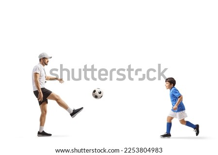 SPorts coach playing football with a boy isolated on white background

 Royalty-Free Stock Photo #2253804983