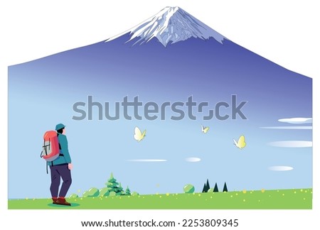 Hiker standing in landscape with Mount Fuji and butterflies fluttering in the spring field