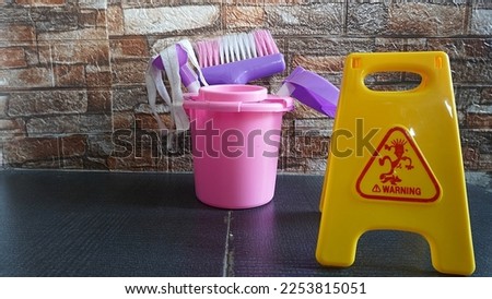 Children's games cleaning tools toy with warning wet signs as a means of educational games                 