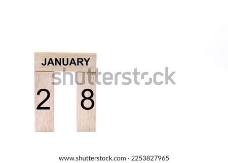January 28 displayed wooden letter blocks on white background with space for print. Concept for calendar, reminder, date. 