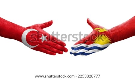 Handshake between Kiribati and Turkey flags painted on hands, isolated transparent image.