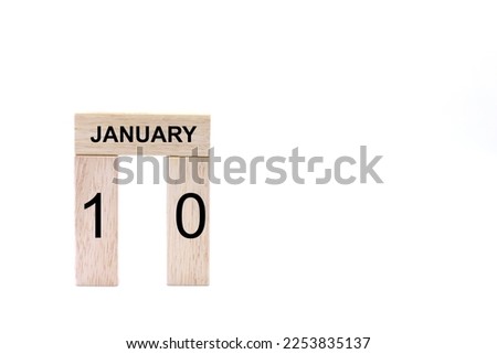 January 10 displayed wooden letter blocks on white background with space for print. Concept for calendar, reminder, date. 