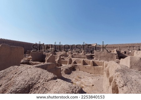 Remains of walls and tower of ancient Rayen Castle (Arg-e Rayen) with its adobe settlements in Kerman Province, Iran