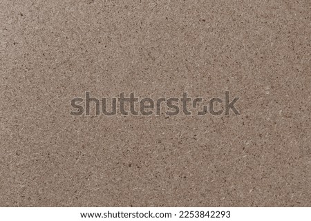 chipboard closeup, texture of a pressed wooden particleboard panel background