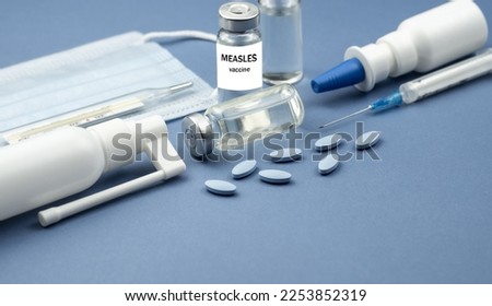 Measles. Measles, mumps (MMR), rubella vaccine, viral vaccine and syringe. Virus, epidemic, disease. Royalty-Free Stock Photo #2253852319