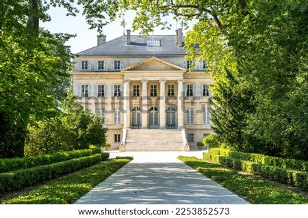 Chateau Margaux in the tree tunnel, Bordeaux, France Royalty-Free Stock Photo #2253852573