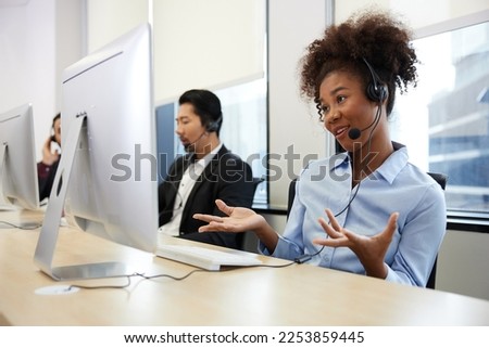 operator or businesswoman wearing headphones and talking online with customer at call center service in the office