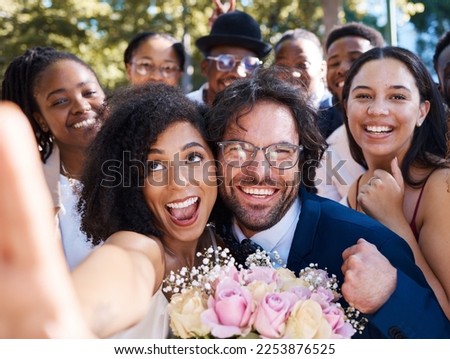 Friends, bride and groom with wedding selfie for outdoor ceremony celebration of happiness, love and joy. Marriage, happy and interracial relationship photograph of togetherness with excited guests