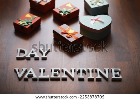 Banner. Valentine's Day. happy valentine's day inscription with gifts on wooden background. The concept of celebration and love.
