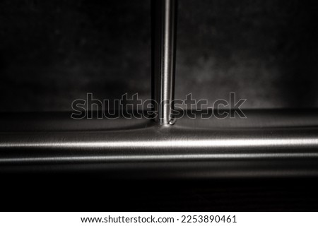 stainless steel railings on a dark background