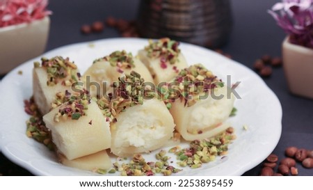Syrian Halawet El Jibn Dessert with Pistachio - Cheese Dough Filled with Cream
