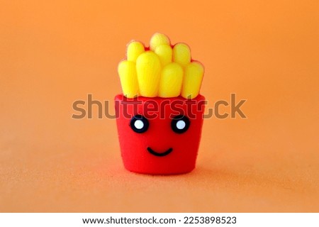 classical fast food french fries in a cardboard package
smiling in a Japanese manga character style
