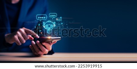Businessman using smartphone for digital chatbot, chat GPT, robot application, conversation assistant, AI Artificial Intelligence concept, digital chatbot on virtual screen. Royalty-Free Stock Photo #2253919915