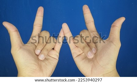 Spiderman hand sign with finger