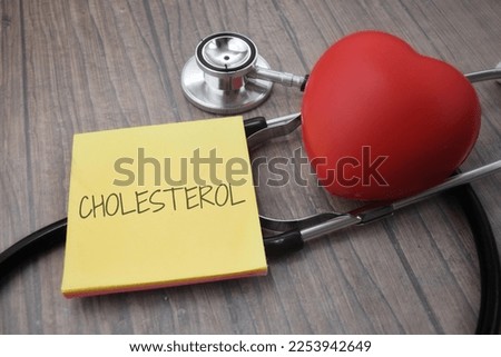 Cholesterol wording with a stethoscopes. Medical concept  Royalty-Free Stock Photo #2253942649